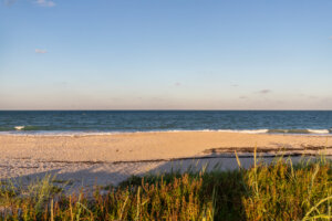 Beach view with a horizon, a blue sky, a big sea and a beautiful vacation landscape, waves
