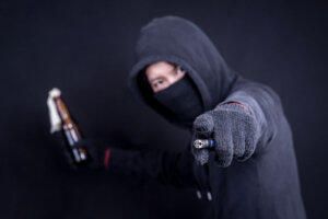 Protester or terrorist with Molotov cocktail as known as petrol bomb or bottle bomb