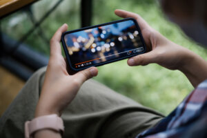 While quarantine a women watching live streaming by application on smartphone