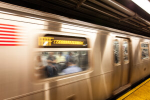 The blur of the F Train leaving the station. New York, NY