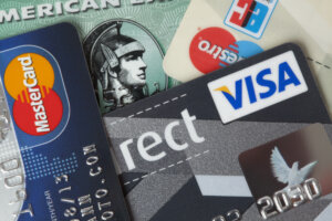 Closeup studio shot of credit and debit cards from MasterCard, Visa, American Express.
