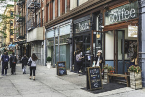 New York, USA - May 12, 2016: Bars and restaurants at Frederick Douglass Blvd at sunset on spring. Frederick Douglass Blvd is one of the main streets of Harlem.