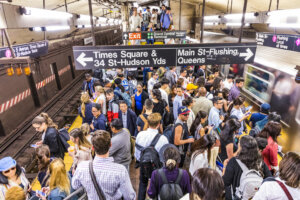 New York: people at metro station Grand Central wait for train to times square and Queens. The Metro in New York is used by more than 100 Tsd people daily.
