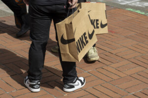 Nike fans who have just purchased new release sneakers from Nike's Flagship Store in downtown Portland, Oregon, are seen on the streets with their nike shopping bags.
