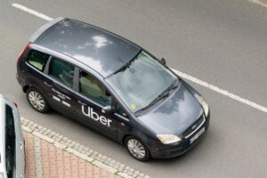 Ford C-Max MPV car of Uber company on road