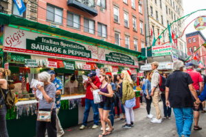 New York Cit Feast of San Gennaro. NEW YORK CITY - SEPTEMBER 21, 2017: View of the Annual Feast of San Gennaro street festival on the street of Little Italy in Manhattan with food vendors, decorations and real people in view.